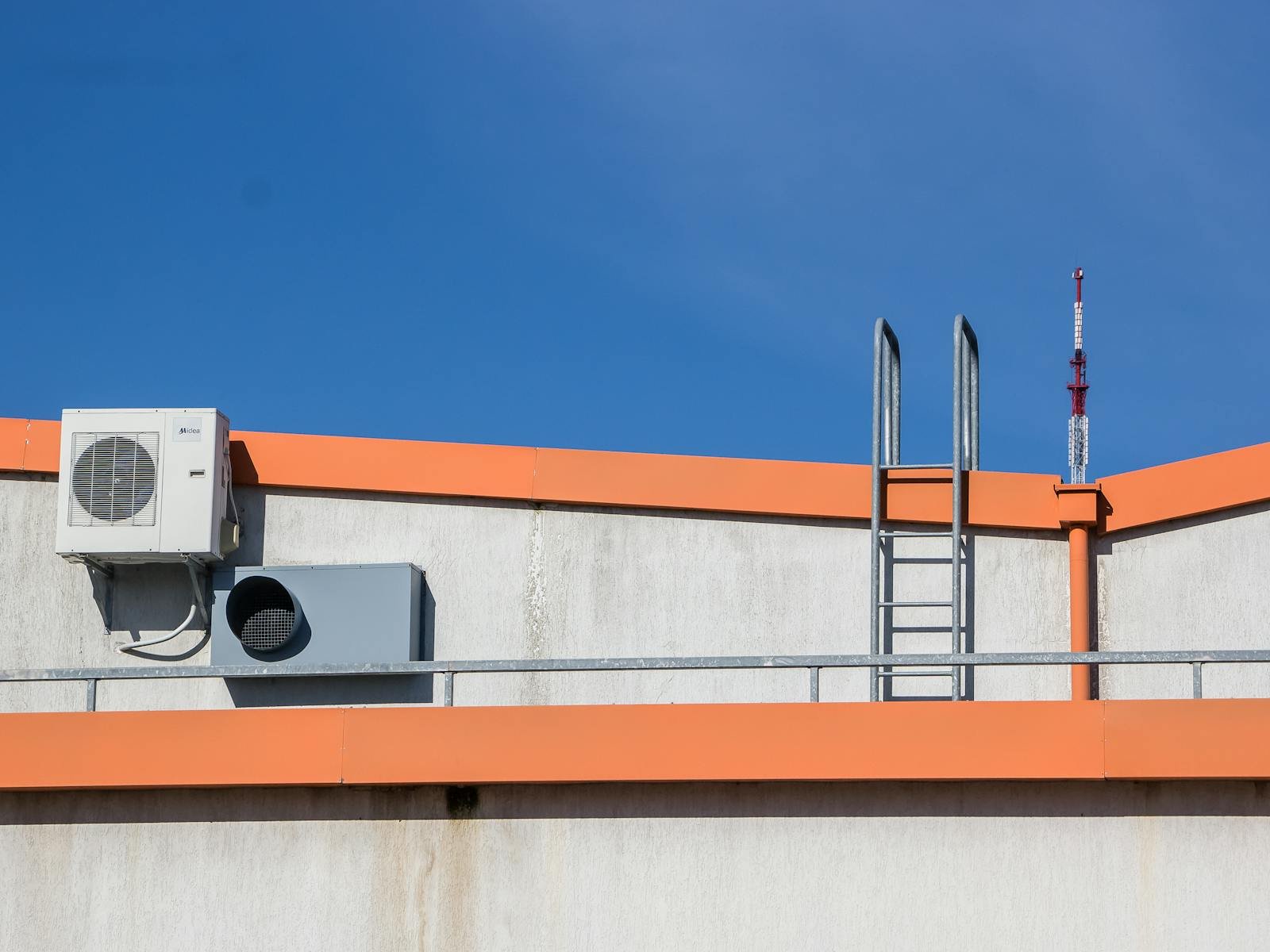 Commercial rooftop HVAC packaged unit on a low-slope roof