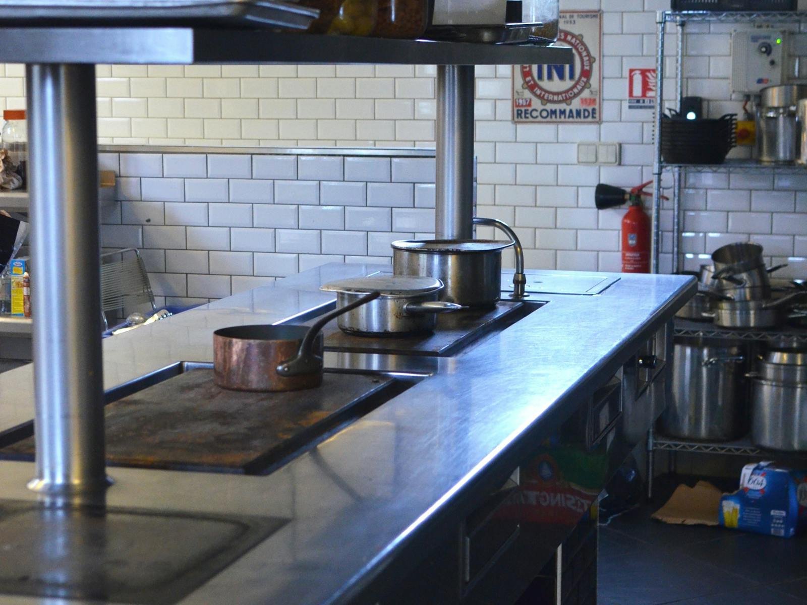 Commercial restaurant kitchen with stainless steel Type I hood ventilation